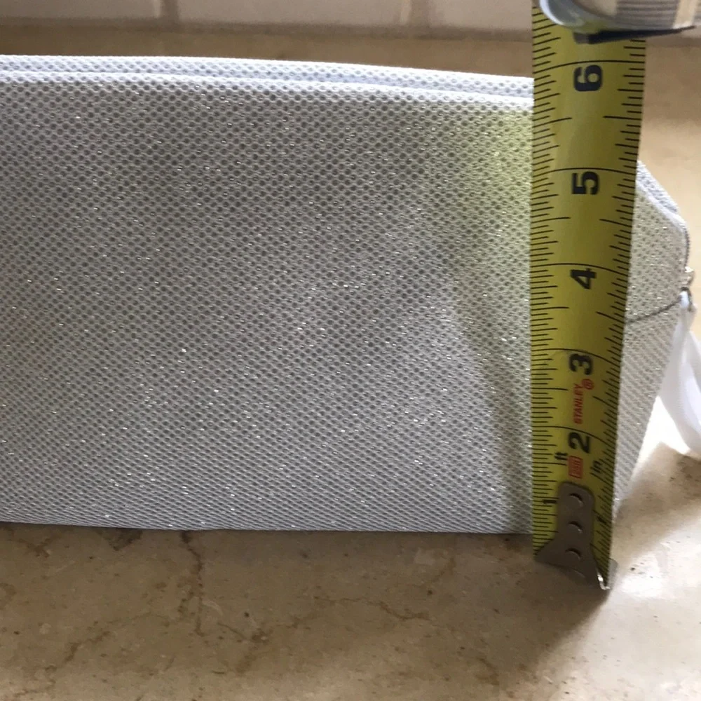 NWOT Orlane Paris silver sparkly lined bag